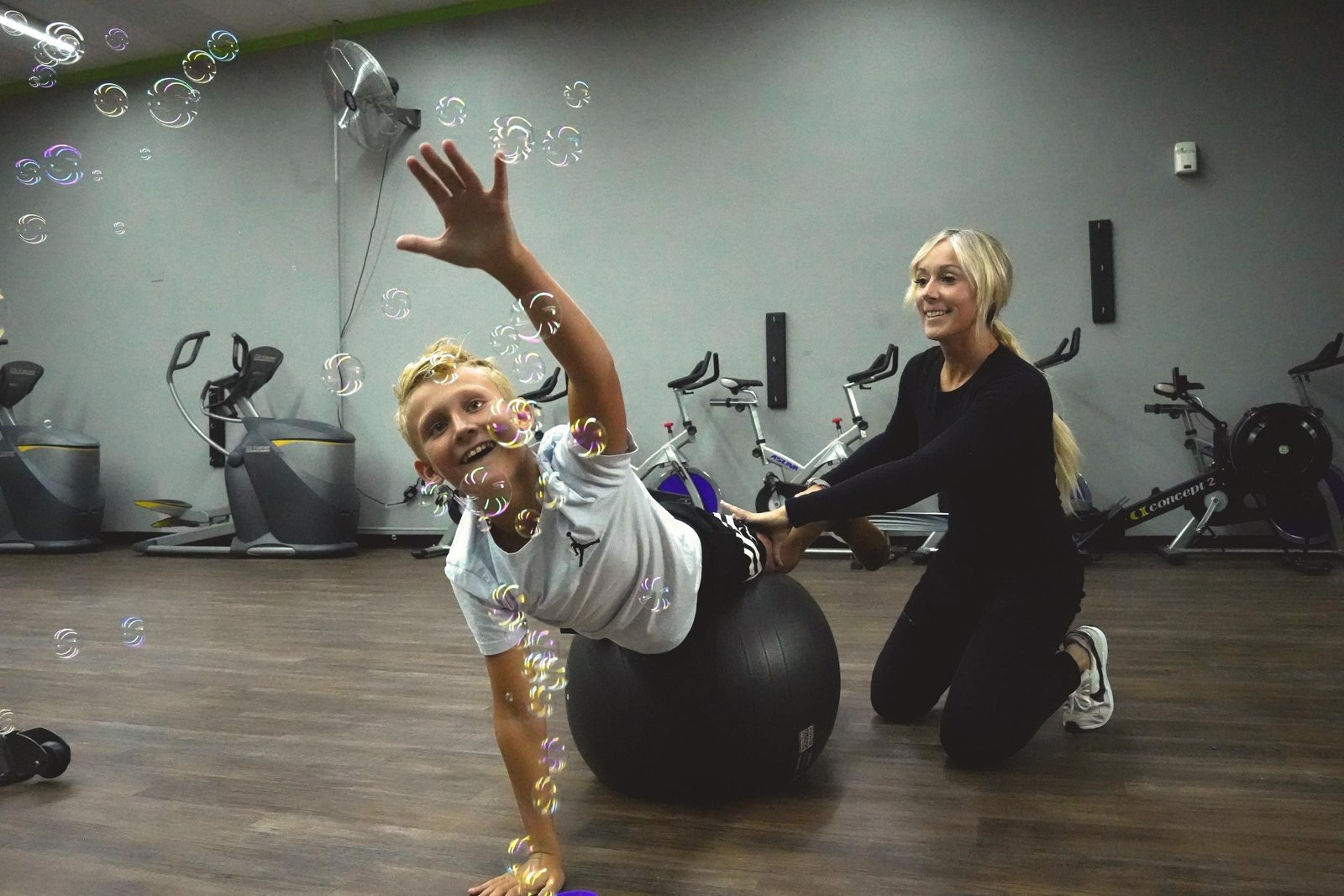 Prone on extended elbows with reaching over a therapy ball